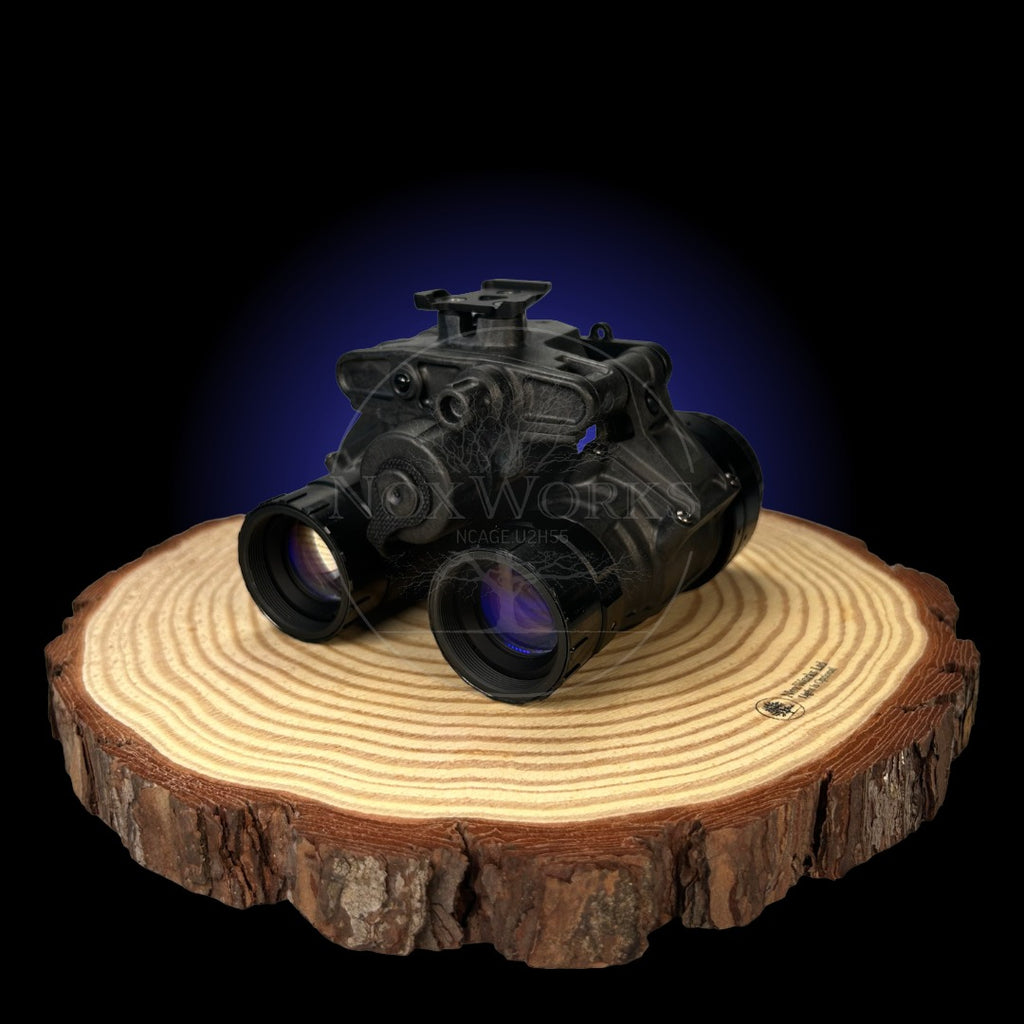 Night Vision Binoculars, the nocturn industries raptor, Built In The UK Displayed from the front on a wooden board